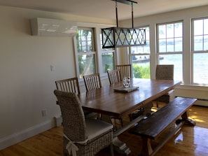 Large dining table easily fits 10 people with view of water.