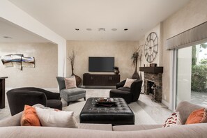 Huge Living Room, comfortable seating and a 80" Flat screen. Relax and Enjoy! 