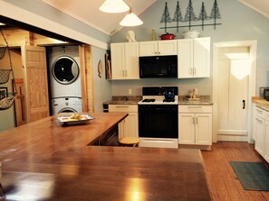 New Kitchen: Washer Dryer, Microwave, Stove (white door is full bath)