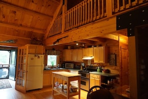 Kitchen. Full fridge, stove, dishwasher. 