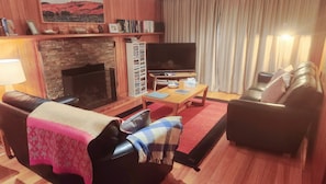 Leather Lounges, Woollen Rugs, Smart TV and an Open Fire in Winter.