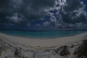 Our house sits on this beach You can see the concrete stairs In the foreground 