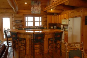 Sit around the bar while you help
With cooking.