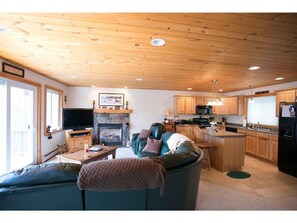 Open concept Living room, kitchen & gas fireplace