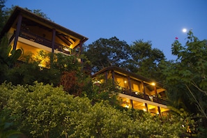 Night view of guest villa on the left and main house on the right