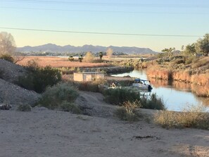 View from back patio. Our own dock and beach entry for launching water toys.