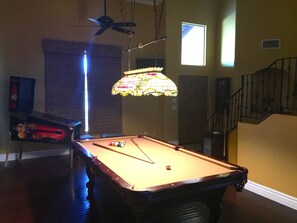 Pool table and pin ball machine.