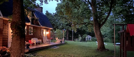 Exterior of cozy coach house deck and back yard.