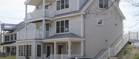 Exterior with three front porches/sunroom