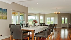A farmhouse dining table that seats 10 and looks out to views.