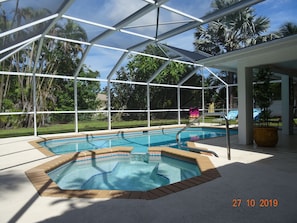 large pool with spa and open but shaded sitting area