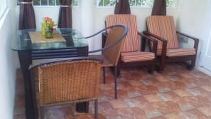 Private patio with security grills, insect screens and lockable patio gate