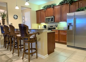 Fully equipped kitchen with stainless steel appliances