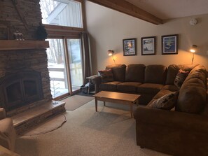Cozy living room with wood burning fireplace