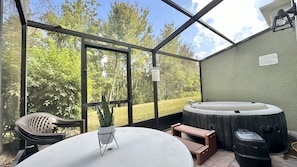 Private screened patio with hot tub