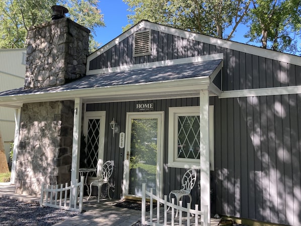 Inviting cottage beside wooded lot for privacy.