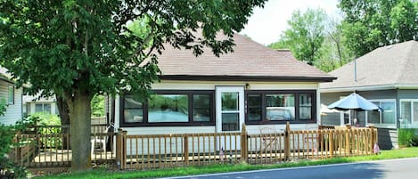 A wonderful front deck allows you to sit steps from the water.