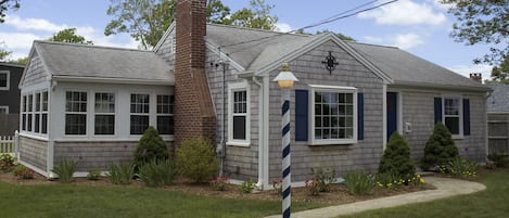 Falmouth Heights Cottage is a grey-shingled classic built in 1950 & updated 2015