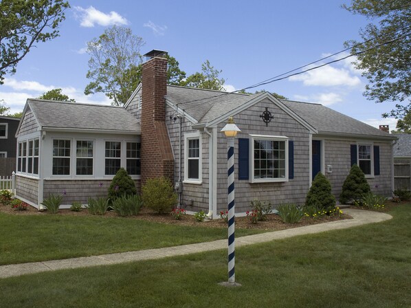 Falmouth Heights Cottage is a grey-shingled classic built in 1950 & updated 2015