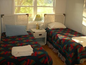 Twin Bedroom with nightstand, dresser and closet
