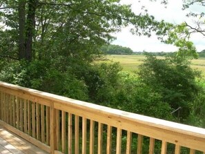 Deck View of Salt Marsh, seats 8 with table, gas grill and outside shower