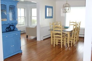 Dining room seats 8 with large window on ocean.  Sun room is to the left