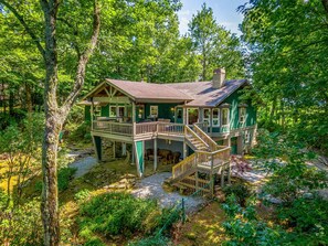 Steps off porch to fenced back yard.