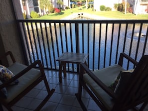 Lanai looks over lake with 2 fountains.  Fitted with comfortable rockers.  