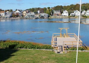 View from the dining room window overlooking the lawn and private dock and float