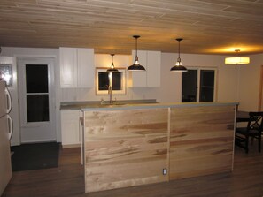 3/4 inch tongue and groove maple used as finishing material on the island.  
