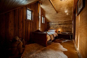 Bedroom upstairs with single bed and lots of toys for kids entertainment.