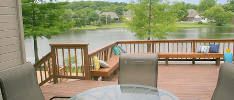 Large deck with BBQ, bench seating and dining seating