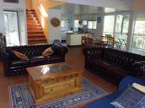 Living area showing stairs to loft