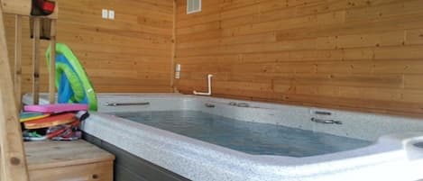 Spa Room with oversized swim spa. Cedar walls that smell so good. Room for 8.