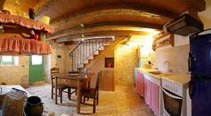 Kitchen with the stairs leading to the bedroom 