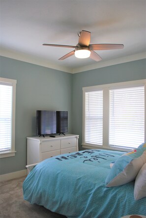 This queen bedroom has very large windows, making the room cheery and bright!