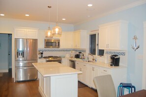 bright kitchen with quartz counters