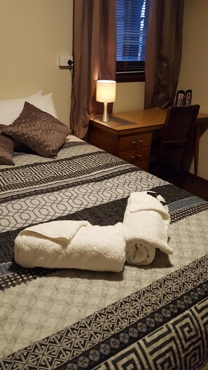 another bedroom with working desk