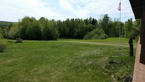 Pond center before tree line.