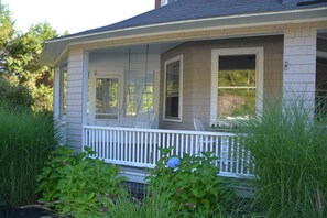 Enjoy the swing on the front porch while kids play in the game room next to you.