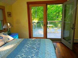 king bedroom with full bath and deck , skylights-bedroom #1