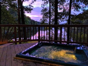 The hot tub is set into the deck overlooking the lake.  The hot tub is big enough for a maximum of 4-5 people at a time.