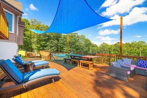 A huge deck with mountain views and ample seating for al fresco dining