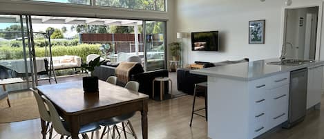 Large open-planned living area, kitchen and meals.