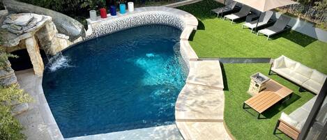 Overlooking the private pool and yard from the balcony 