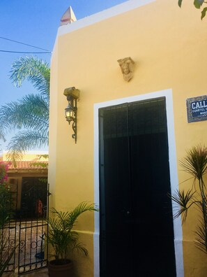 Main entrance to home with interior courtyard and fountain.
