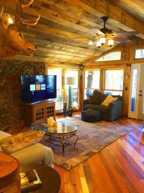 Great room with lots of windows and light, exotic wood floors and ceiling!