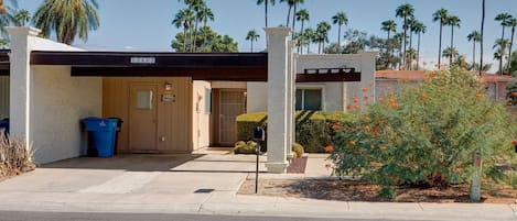 Curb view. Private double carport.