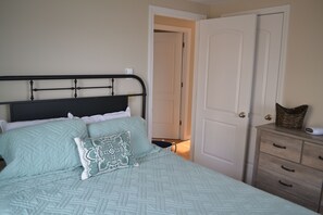 Queen bedroom with bureau and cable TV
