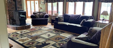 Living Room with couch, love seat, oversized chair, Roku tv
